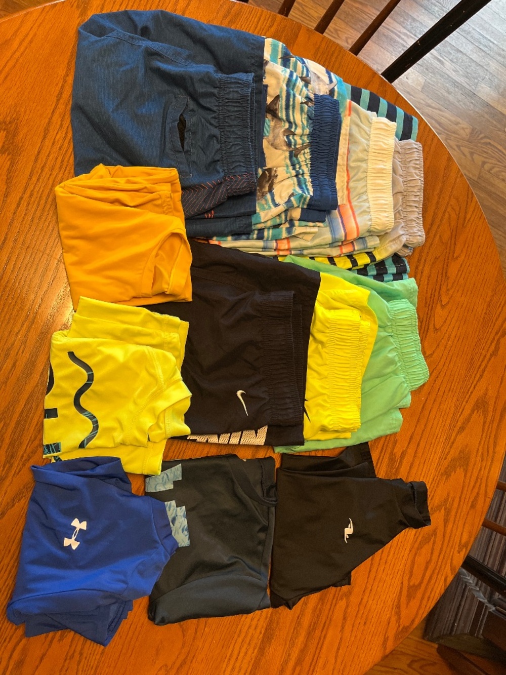 12 pcs boys swimwear, different sizes and brands like Nike, Under Armour etc